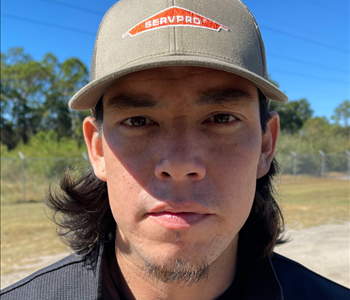 Male with black hair and SERVPRO logo'd hat