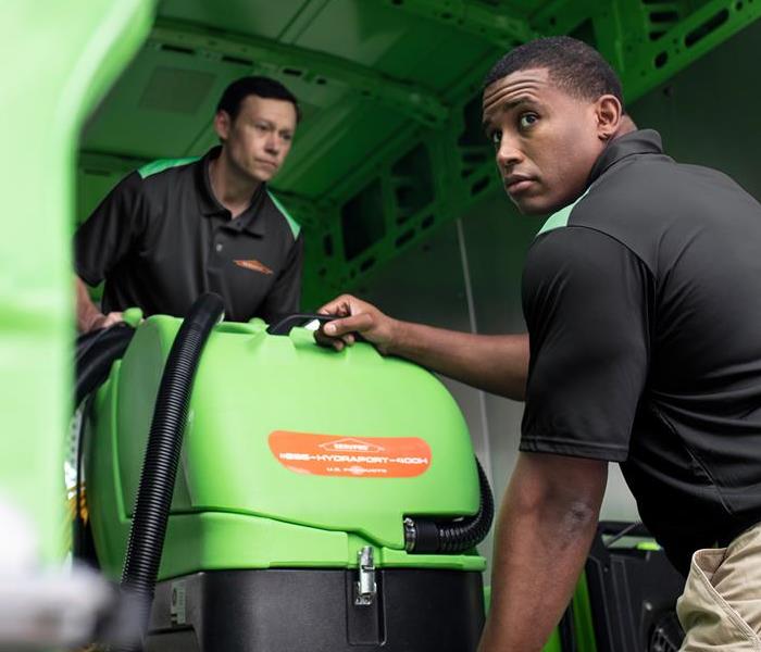 SERVPRO employees unloading equipment.